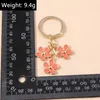 Schlüsselanhänger Lanyards süße farbenfrohe Blütenschlüsselketten Emaille Blume Charms Schlüsselring Frauen Männer Auto Bag Anhänger Schlüsselketten DIY -Schmuckzubehör Accessoires