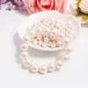Strand Moda de moda elegante Elastic White Pearl Bracelet para homens Banquetes de casamento Bracelets Stretch Bracelets de 6 a 12 mm