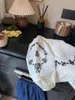 衣料品セット2024春秋のベージュのベージュのアプリコットカラー甘くてかわいいデザインのシャツダークブルージーンズ