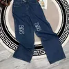 Kvinnliga jeans designer byxor kvinnor män brev broderade grafiska denimbyxor lösa jeans lyx mode fasta färg denim byxor