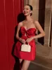 Moda czerwona kokardka pusta mini sukienka dla kobiet seksowna bez ramiączek bez pleców Slim Fit Sukienki A-Linia Elegancka impreza balowa Vestido 240412