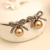 Stud -oorbellen 2024 Aangekomen romantische stijl vintage kleur inleg kunstmatige diamanten parels bowknot voor dames sieraden