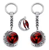 Sharingan Eye Keychain Accessoires 360 graden Roterende maan hanger Uchiha Sasuke Kakashi Anime Keychains Charms Metal Key Ring G17154388