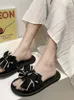Slippers à nœud papillon pour les femmes portant des chaussures pour femmes à la mode sorties d'été