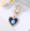 Acqua Drop Cuore Evil Evil Eye Keyring per la coppia di amici Enamel Blue Eye Borsa Accessori per il fascino per auto gioielli3284829