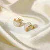 Boucles d'oreilles à goujon 16k plaqué en or inoxydable Swirl White Perlized Emanel Dome pour les femmes Girls Tarnish Bijoux gratuit Cadeau