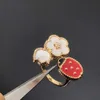 Marca original van quatro folhas grama joaninha anel feminino de alta edição branca fritillaria rosa ouro ornamento