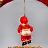 Dekoratif Figürinler 2pcs Noel Dekorasyonları Oynak Noel Baba Maruz Kalma Dekorasyon Bahçesi Heykeli Reçine Zanaat Süsleri Kırmızı Kolye