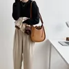 Bag 2024 Koreansk version av kvinnors mode nisch axel messenger retro u-formad trend