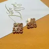 Luo Familys French style full diamond earrings are meticulously carved with heavy craftsmanship and the highendf eelingi si nlaidw ithd iamondsTh ege ometricho llo