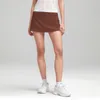 LL Leggings Top Lu Yoga Sports Skirt Leatness Wear Suit Outdoor Suit Quicking Direcing Tennis Shorts Tennis Heared Skirt مزيفة من قطعتين من قطع الخصر عالي المرونة