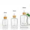 Lagringsflaskor Transparent 30 ml 50 ml 100 ml Flat Square Cosmetic Serum Essential Oil Glass Droper Bottle With Bamboo Cap 15 ml