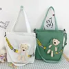 Ryggsäckväska handväska all-match messenger söt liten koreansk stil duk kvinnor crossbody löstagbar björn leksak
