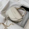 バッグサドルトートメタルハンドル2024ファッション品質PUレザーの女性デザイナーハンドバッグチェーンショルダーメッセンジャー