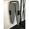 Trabalho de moda de trabalho Espaço conjunto de algodão Triângulo Rótulo de bolso Block Block Slave Zipper+calça casual da cintura elástica