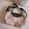 Hoog goedkope winkel 90% stof van groothandelzak dames koehide hoge versie jeugd nylon met kleine casual crossbody zwarte portemonnee dumpling schouder luxe handtas tote tote