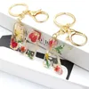 Keychains Lanyards Exquisite Dried Flower A-Z Letter Resin Keychain Creative Glitter 26 Initial Alphabet Keyring Women Handbag Accessories Gifts