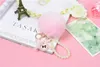 Keychains Lanyards 2022 Mode Pearl Chain Crystal Bottle Bow Pompom Keychain Car Women Handbag Key Chain Ring Fluffy Puff Ball Keychains smycken