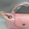 Projektanty torebki dla kobiet 2024 różnica hurtowa oryginalna perforowana różowa kolorowa toaleta Wersja paska nylon mini niewielkie pierścień małe wybierz ramię 7WCT