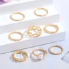 Kreativ minimalistisk 8-delad gemensam ringset med konstnärliga pärlor och kärleksringar