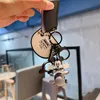 Creative and Personalized Retro Mi, Mouse Couple Rotating Small Plane Keychain Female Cute Cartoon Small Pendant