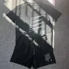 Uomini e donne designer tracce tech fitness stampare l'abbigliamento sportivo asciugatura rapida e la maglietta della giuntura traspirante Shorts Shorts a due pezzi.