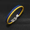 Andra armband Blue Yellow Armband Ukrainska flaggfärgsarmband smycken Ukraina flagga flätat läderarmband för män kvinnor barnl240415