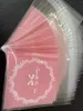 Wrap Prezent 100pcs Różowa samowystarczalna torba Opp przezroczyste ciepłe romantyczne łuk wydrukowane małe torby i plecak cukierkowy