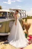 2024 Nuovi abiti da sposa Sexy Deep V Neck Appliques in pizzo Beach Bridals Bridals Custom Doorless Train A Line Wedding Dress