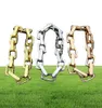 Fashion UNISEX MENS DESIGNER V Bracelets Gold Square Link a catena in acciaio di titanio colorato 1122657