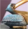 Estatuetas decorativas Estátuas de resina criativa A estátua pelicana pássaros toucanos de entrada de toucano e chaves de cesto de armazenamento decoração de decoração de decoração