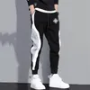 Pantaloni da uomo abbigliamento da uomo abbigliamento da uomo pantaloni casual jogger streetwear in esecuzione di colore grigio nero stampato patchwork 240412