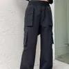 Kvinnornas leggings A24 Hög midja arbetskläderbyxor, svart löst passande amerikansk gatastil med en unik dragkedja i midjan