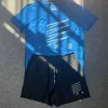 Uomini e donne designer tracce tech fitness stampare l'abbigliamento sportivo asciugatura rapida e la maglietta della giuntura traspirante Shorts Shorts a due pezzi.