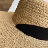Strohoed vrouwen brede randzonbescherming strand hoed zwart en wit lint bowknot stro cap casual dames platte top panama hoed 240412