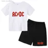 Kläder sätter sommarbarn kläder AC DC rund hals t-shirts+ shorts sätter lämplighet 2-12 år pojkar flicka avslappnad kort ärm bomullstryck T240415