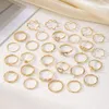 Hot Selling Minimalist Diamond Inlaid Wave Heart Set of 28 Pieces, Gold Joint Alloy Ring Combination Bracelet for Women