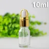 収納ボトル工場卸売グラス10ml eジュースエリキッド空のガラスドロッパーボトル金銀ねねじキャップが入っています