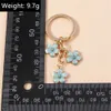 Keychains Lonyards mignon sakura pendentif porte-clés simples fleur en émail pivot