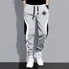 Pantaloni da uomo abbigliamento da uomo abbigliamento da uomo pantaloni casual jogger streetwear in esecuzione di colore grigio nero stampato patchwork 240412