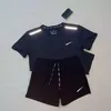 Uomini e donne designer tracce tech fitness stampare l'abbigliamento sportivo asciugatura rapida e la maglietta della giuntura traspirante Shorts Shorts a due pezzi.