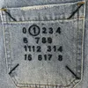 M6 Família 24SS Early Spring Classic Back Bag Back Bordado Marca de couro digital Jeans de perna reta para mulheres