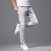 Męski projektant dżinsów męski projektant dżinsów wysokiej jakości marka mody męskiej Summer cienkie elastyczne spodnie myte dżinsy haft ciemne kwiaty