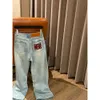 Automne / hiver Luo rouge brodé de la taille arrière étiquette en cuir en cuir denim pantalon à pattes larges