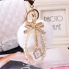 Keychains Lanyards Fashion Faux Fluffy Crystal Bottle Bow Pompom Keychain Pearl Chain nummer 5 Kvinnor Handväska bil Key Chain Ring Keychains smycken