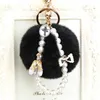 Keychains Lanyards Fashion Faux Fluffy Crystal Bottle Bow Pompom Keychain Pearl Chain nummer 5 Kvinnor Handväska bil Key Chain Ring Keychains smycken