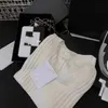 Tricot de tricots pour femmes 2024 début de printemps Nouveau nanyou gaoding cha à la mode, simple et élégant, polyvalent, mince couche à cou de couture à manches courtes KJ6v