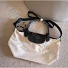 Hoog goedkope winkel 90% stof van groothandelzak dames koehide hoge versie jeugd nylon met kleine casual crossbody zwarte portemonnee dumpling schouder luxe handtas tote tote