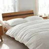 Sängkläder uppsättningar 3,2 kg fyra-stycken omslagsark Bäddkuddfodral Vanlig bomull tvättad 4st Set Simple Student Use Home Textile