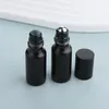 Botellas de almacenamiento 50/100pcs/lote 5 ml Matte Black Essential Bottle Rollable Rollable en perfume Cosmética de rodillos de vidrio Frost